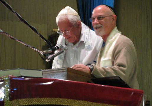 Two members at Bima singing and Praying.